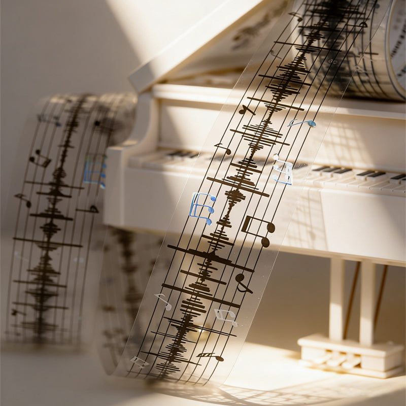 The Music Flow Series Laser Silver PET Tape featuring silver, and music designs for journaling, scrapbooking and collage
