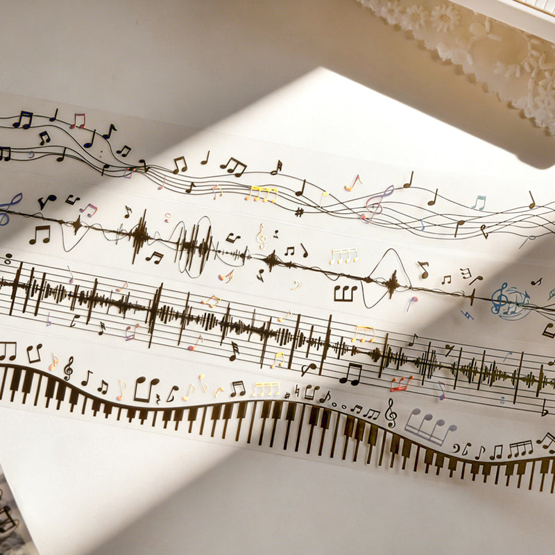 The Music Flow Series Laser Silver PET Tape featuring silver, and music designs for journaling, scrapbooking and collage